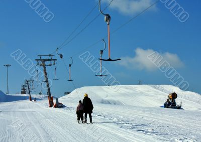 skiers on the lift