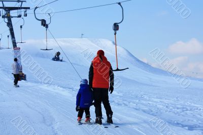 skiers on the lift