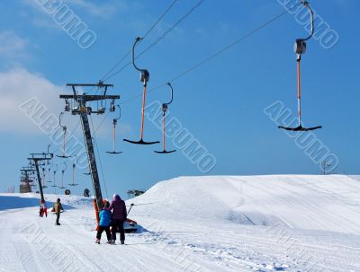 skiers on the lift