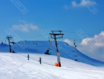 skiers on the lift