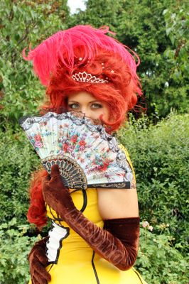 woman in a vintage dress with  fan