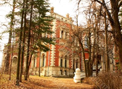 Abandoned old estate among the leafless trees
