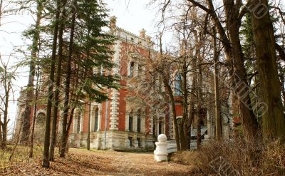 Abandoned old estate among the leafless trees