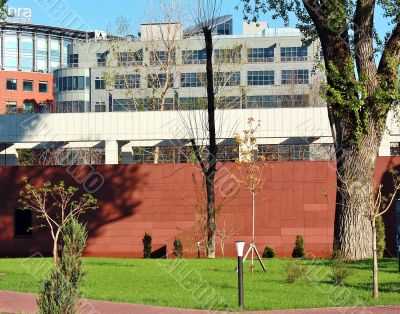 Buildings behind the red fence
