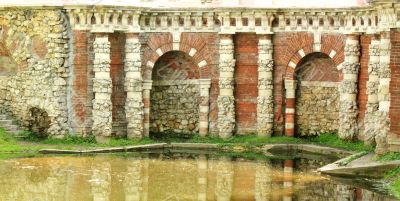 Grotto on the pond&rsquo;s shore
