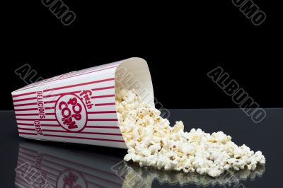 bucket of spilled popcorn
