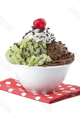 a bowl of ice cream with cherry