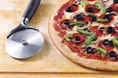 pizza with pizza cutter