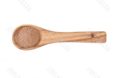 wooden spoon with chocolate powder wooden spoon with chocolate powder
