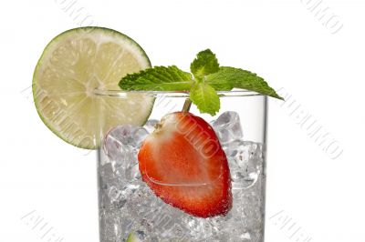 cropped image of a glass with ice cubes strawberry slice and lemon slice