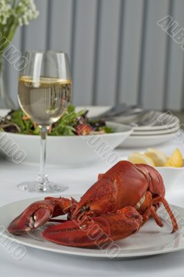 dinner table with lobster and wine