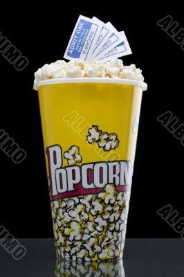popcorn and tickets isolated on the dark background 