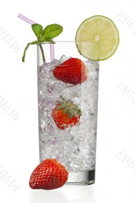glass full of ice cubes with strawberries and decorated with lemon slice and peppermint
