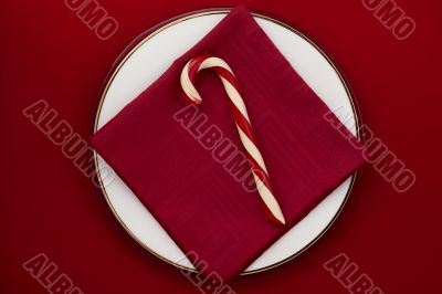 candy cane on red background