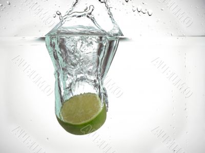 half lime dropped in water