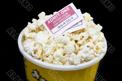 cropped image bucket of popcorn with movie ticket