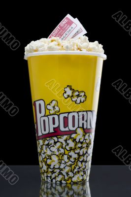 large popcorn bucket with movie passes