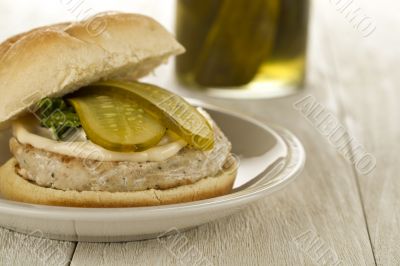 chicken hamburger with slices of pickle