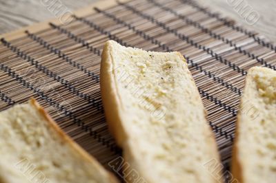 buttered toasted baguette bread  with garlic spread and pepper 