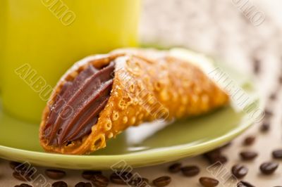 close up image of a pastry in saucer close up image of a pastry in saucer