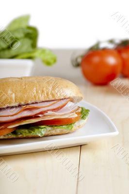 cropped ham sandwich in plate