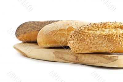 cropped image of breads on the wooden plank 