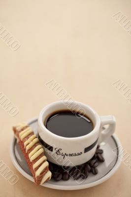 hot coffee with biscuit and coffee beans in a white saucerf hot coffee with biscuit and coffee beans in a white saucerf