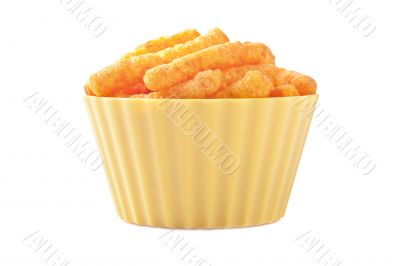 cheese puffs in yellow plastic bowl