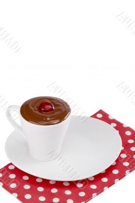 strawberry in cup of melted chocolate