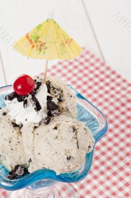 cookies and cream ice cream with cherry and umbrella