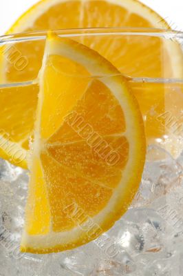 cropped image of orange slices with ice cubes