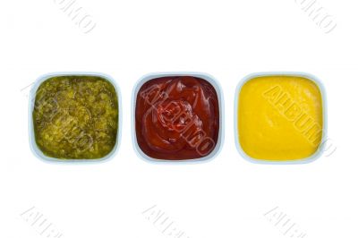ketchup mustard pickles on bowl