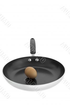 brown egg in frying pan