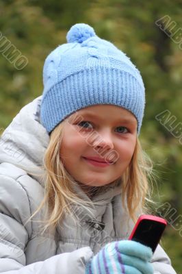 Small girl with cellular phone