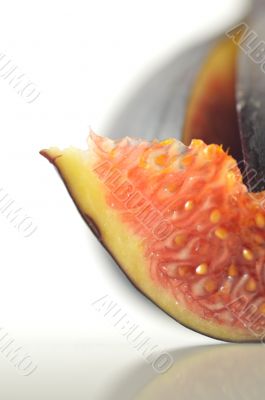 slices of fig on a white background slices of fig on a white background