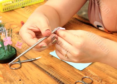 Women`s hands with needlework