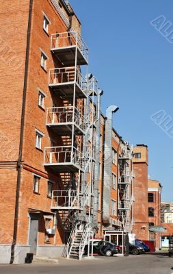 Metal ladder at the wall of the house