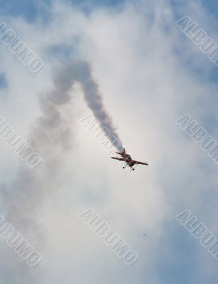 Plane of the aerobatic  group “First flight” in the sky