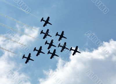 Aerobatic group on the background of white clouds