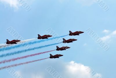 Aerobatic  group on the background of white clouds