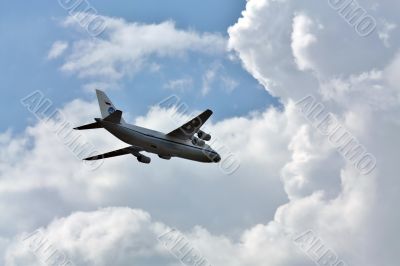 Russian transport airplane in the summer sky