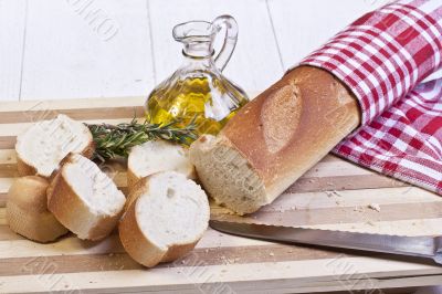 sliced baguette bread and oil