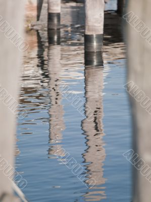rippled water reflection of dock