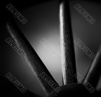 black and white image of a wheel spokes
