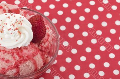 strawberry ice cream with toppings on the bowl