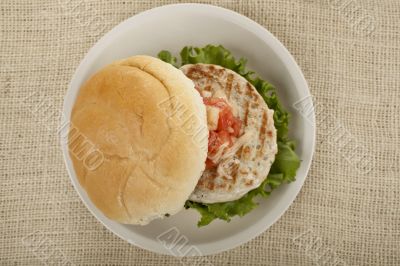 plate of grilled chicken burger