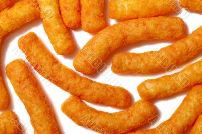 scattered cheese puffs scattered cheese puffs
