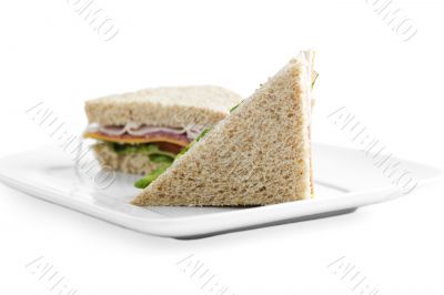 two slices of ham and vegetable sandwich
