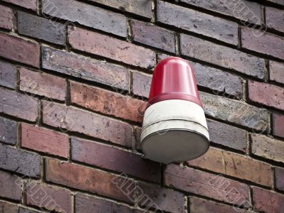 alarm-red-brick wall