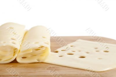 slices of cheese on wooden plate